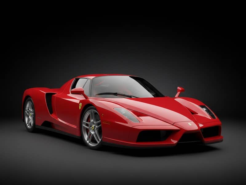 Custom-fit leather floor mat installed in Ferrari Enzo interior showing perfect OEM fitment