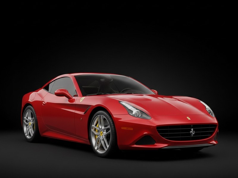 Custom-fit leather floor mat installed in Ferrari California T interior showing perfect OEM fitment