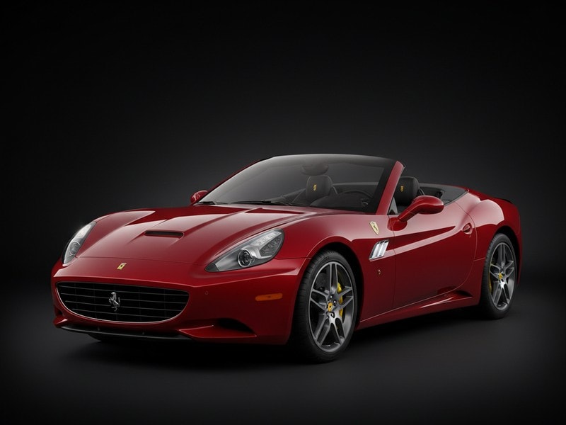 Custom-fit leather floor mat installed in Ferrari California interior showing perfect OEM fitment