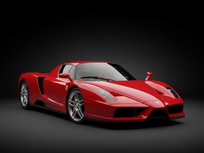 Custom-fit leather floor mat installed in Ferrari Enzo interior showing perfect OEM fitment